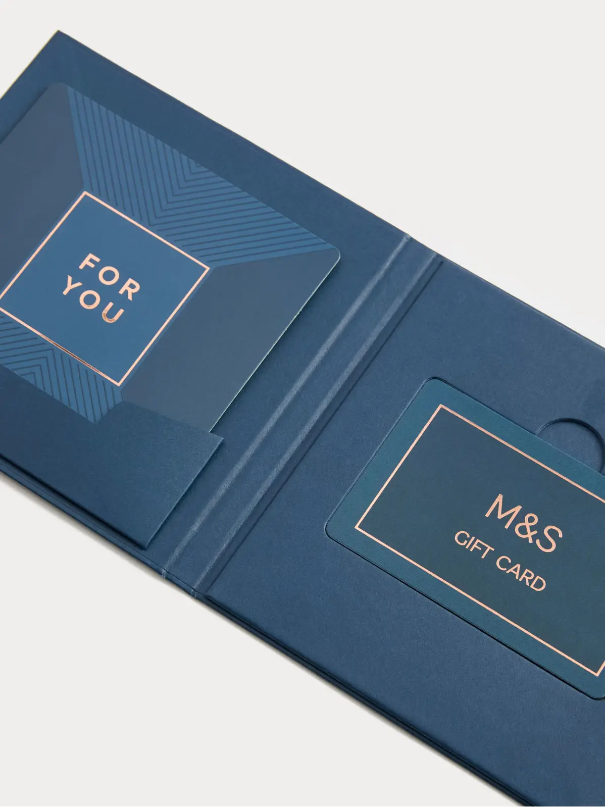 Blue M&S gift card with gold foil details 