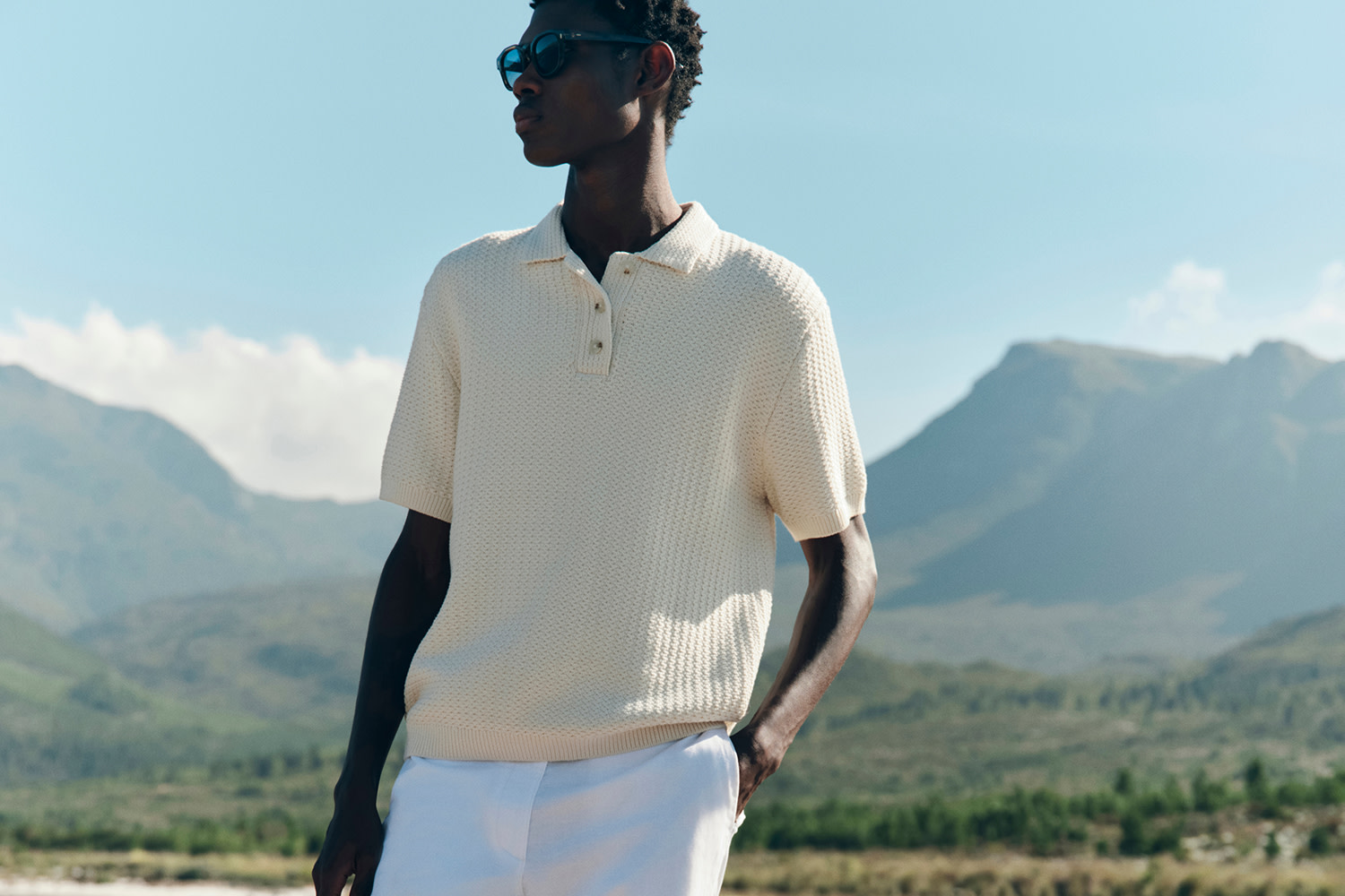 Man wearing light-toned polo knit