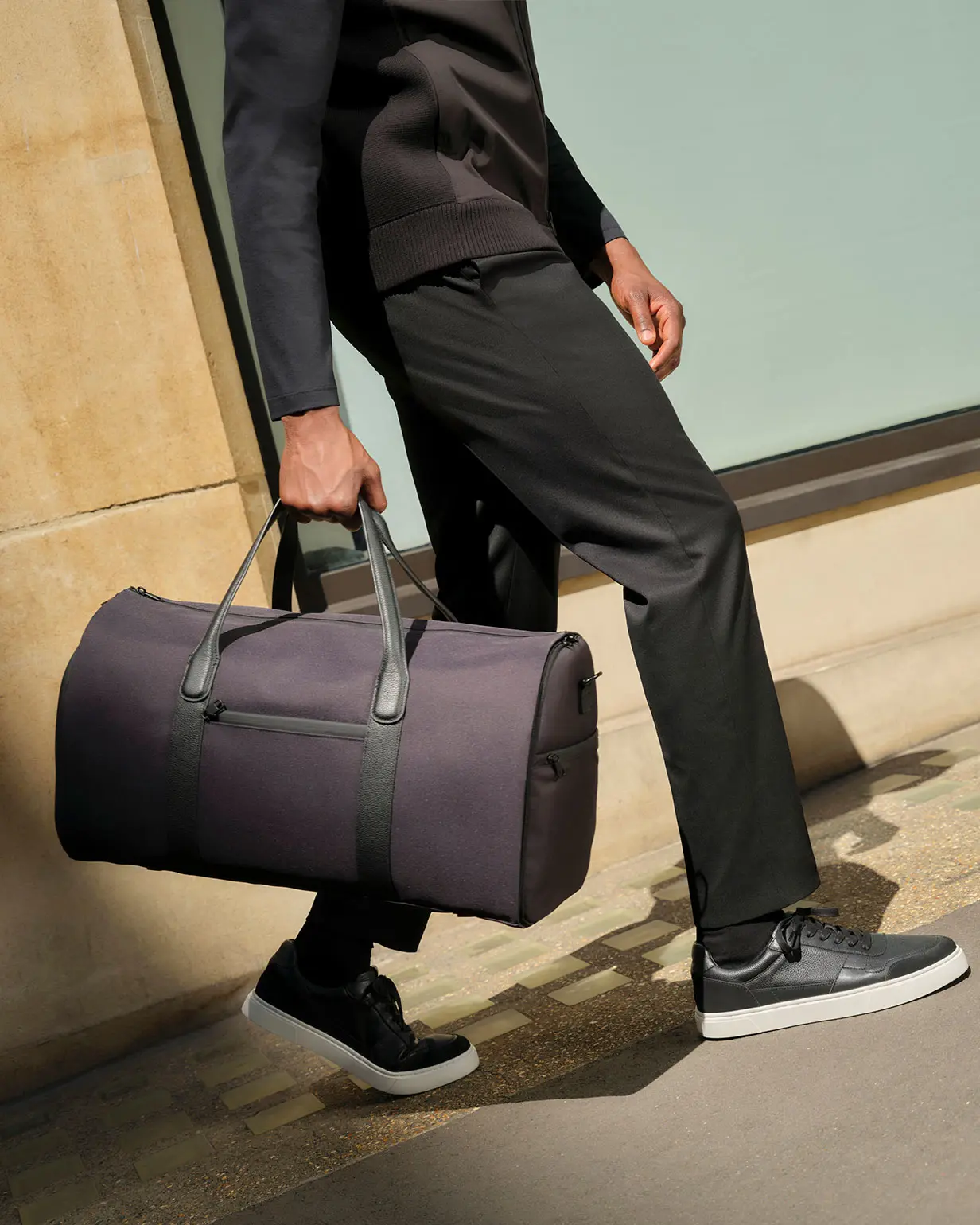 Man wearing black trouser and jacket from Autograph Performance