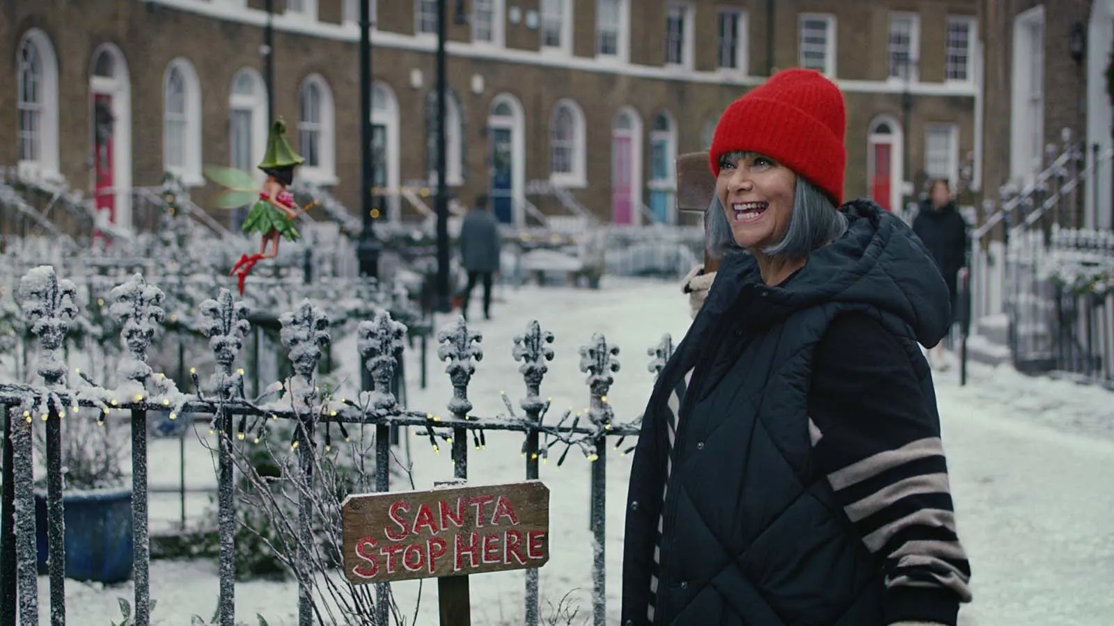 Dawn French on a Christmassy street