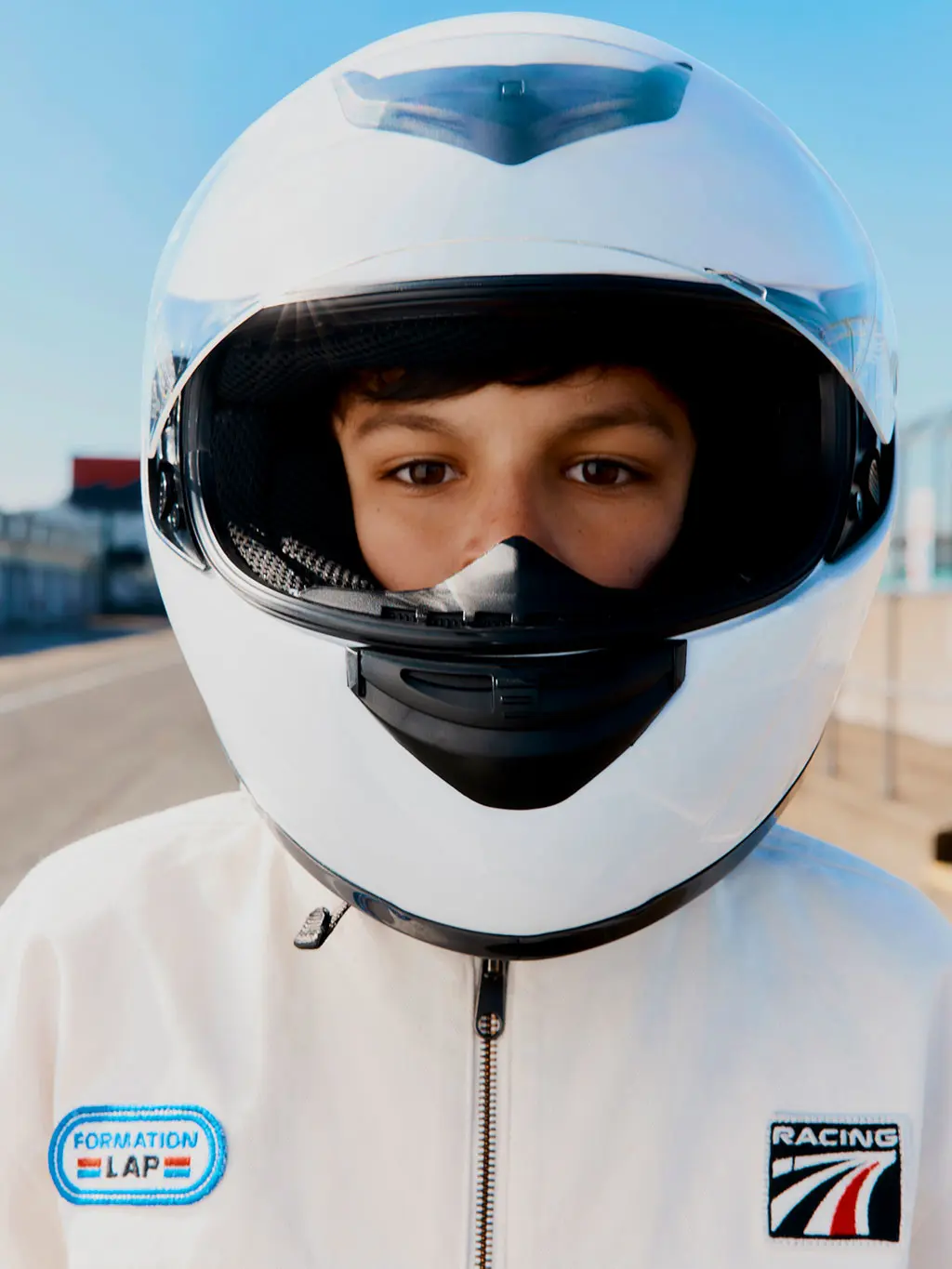 Boy in racing helmet