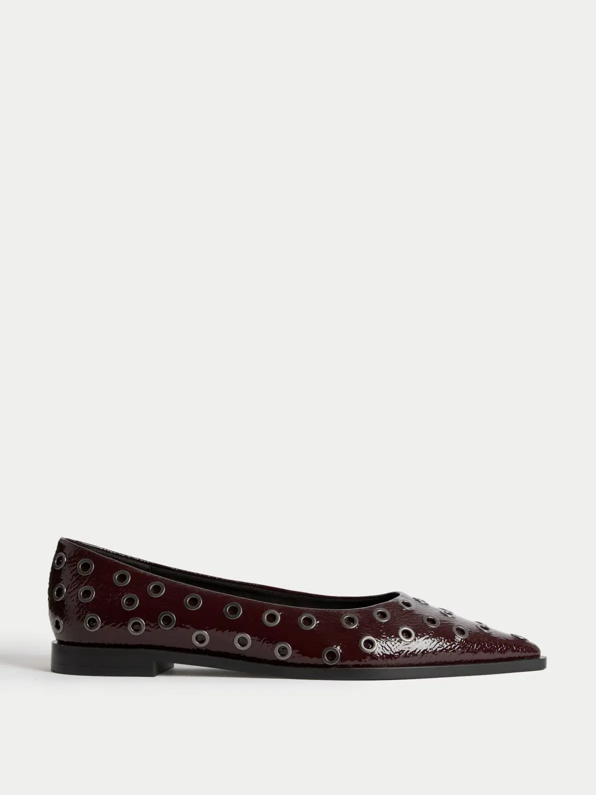 Patent studded flat pointed shoe in dark red