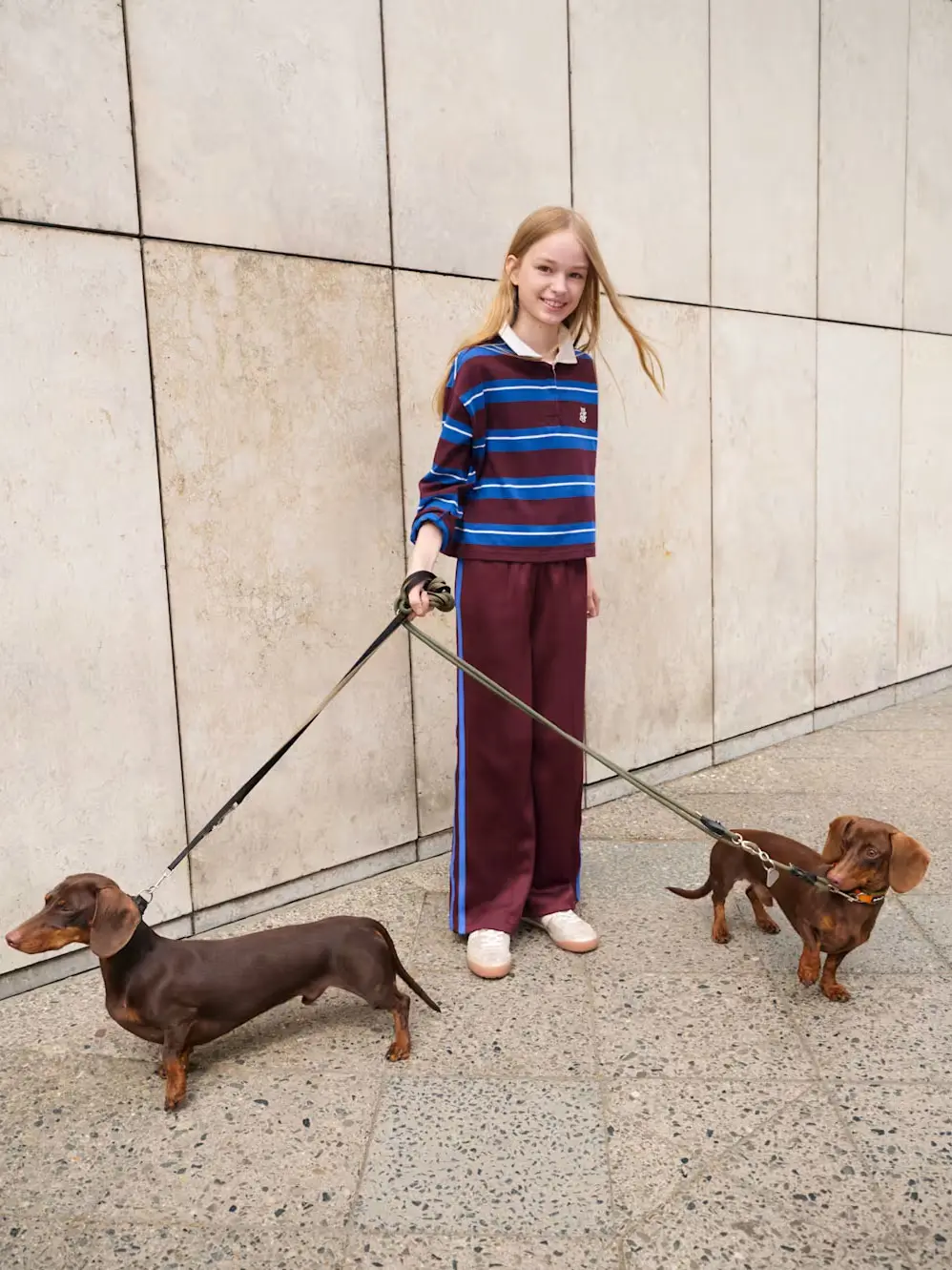 Girl walking dogs