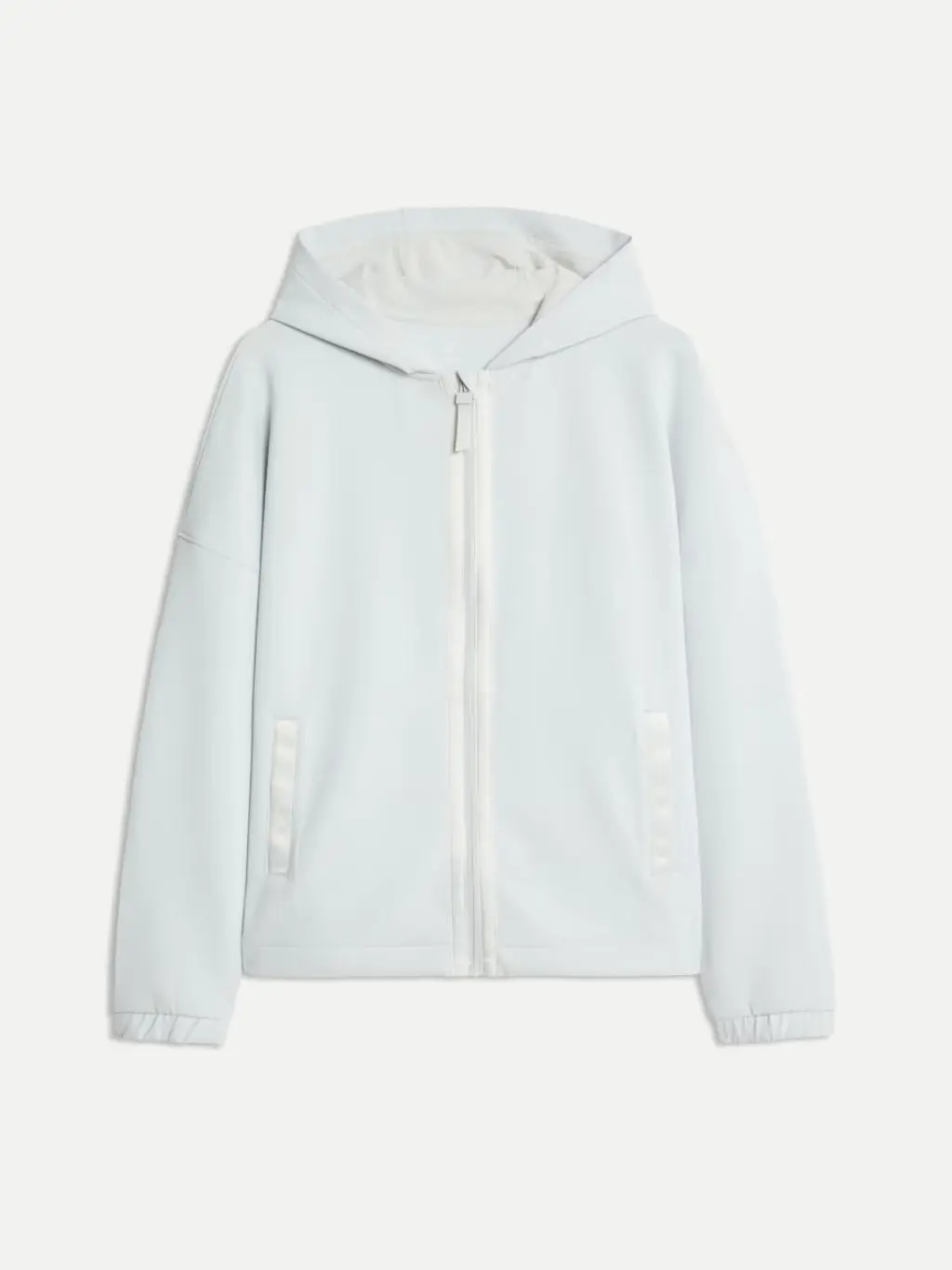 A cutout of a light grey hooded jacket against a beige background