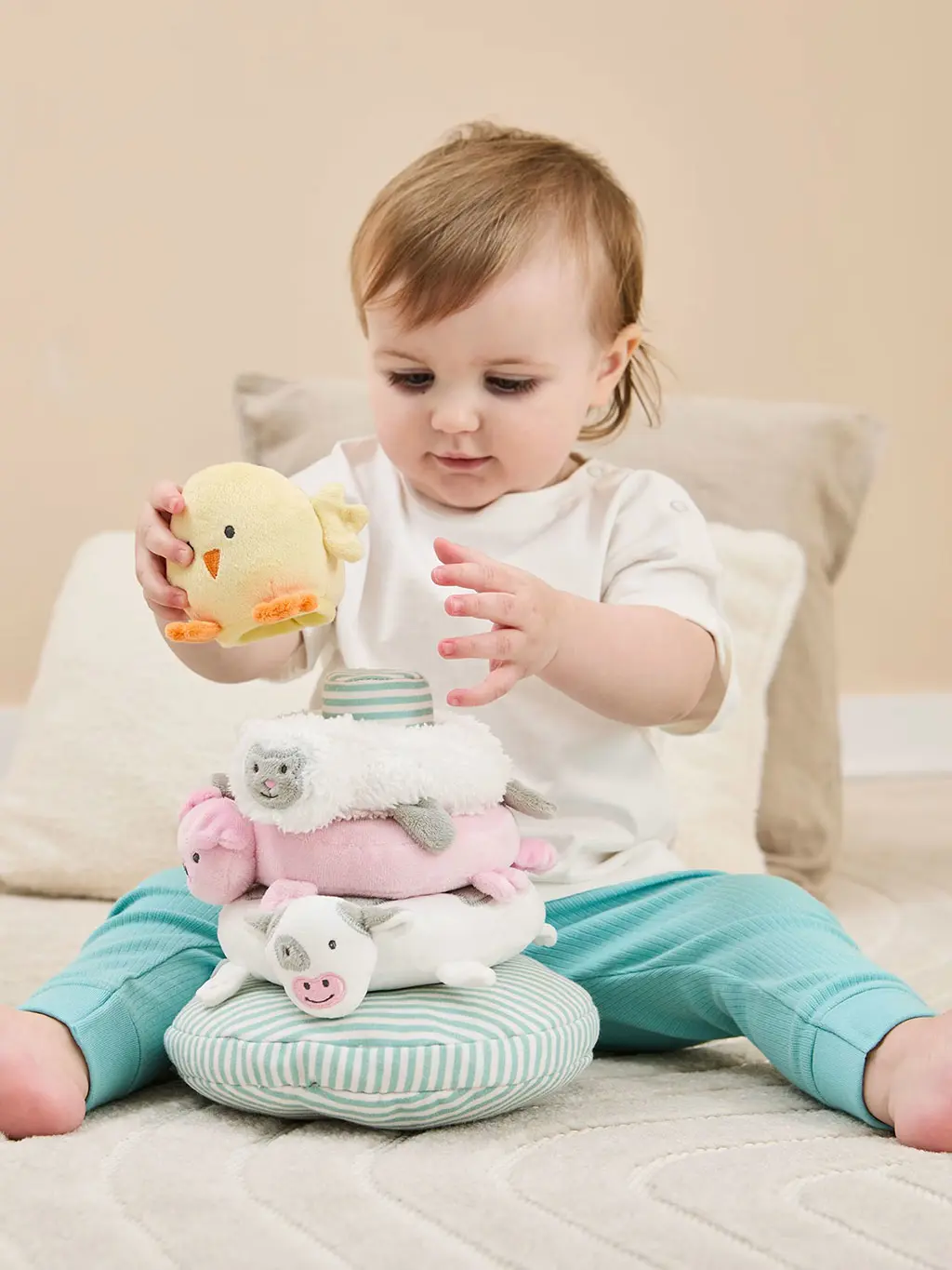 Baby playing with a stacking toy