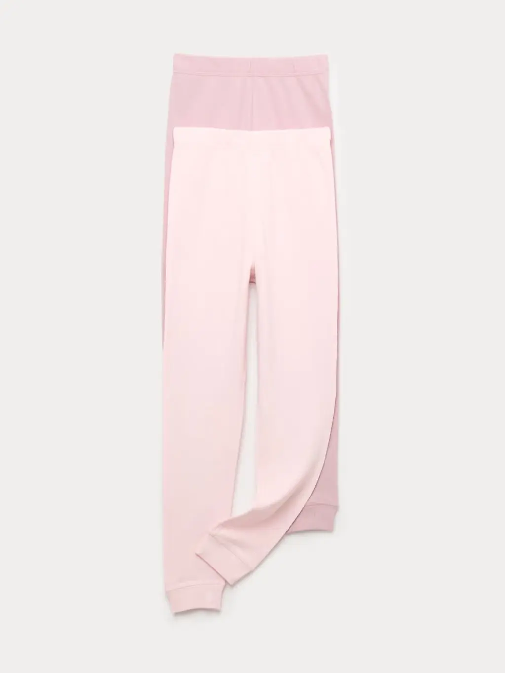 A cutout of two pairs of pink thermal leggings