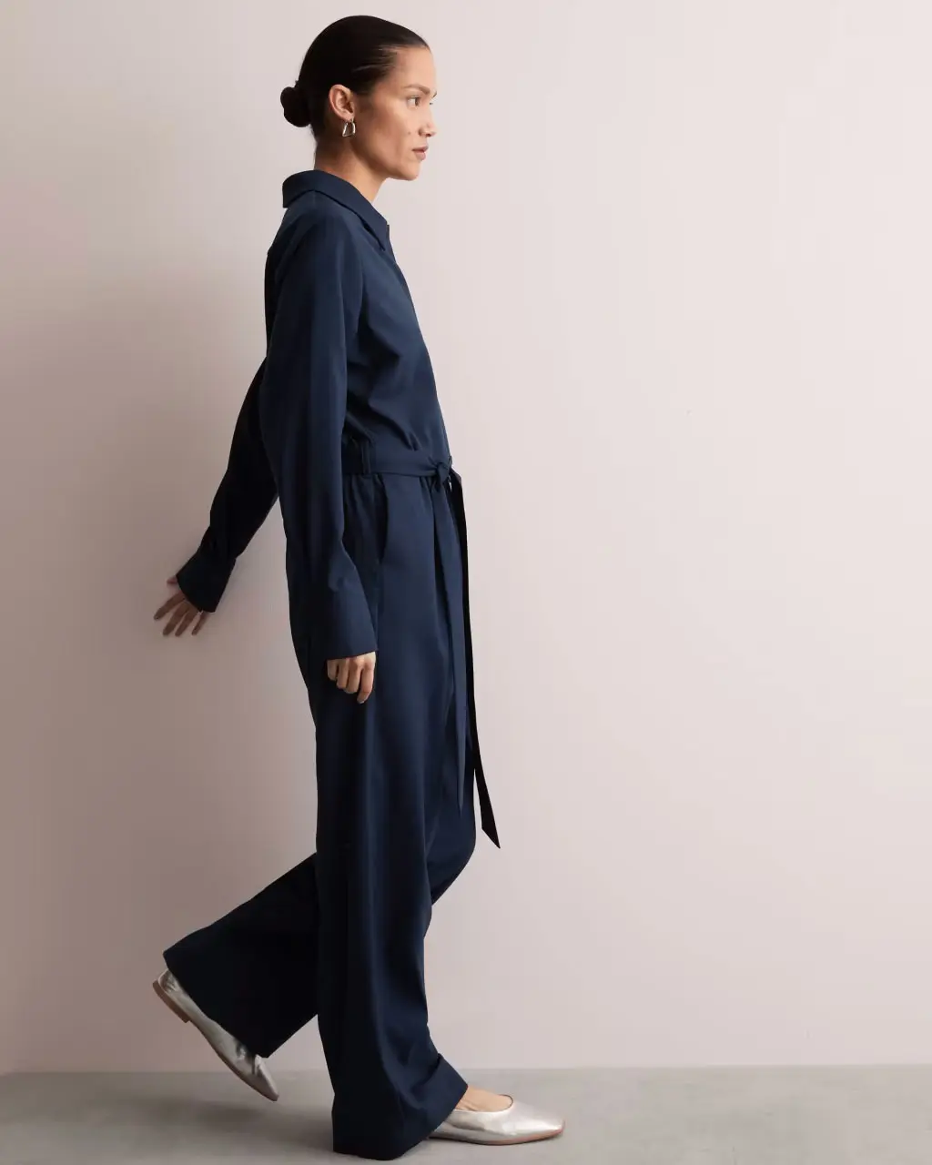 Woman wearing navy Jaeger jumpsuit