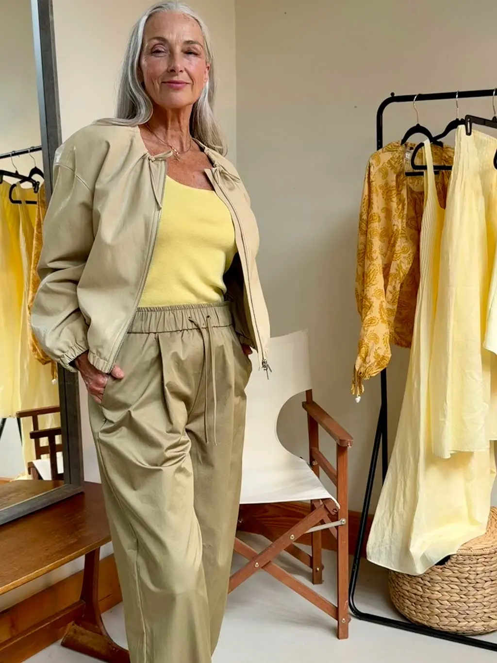 Woman in yellow top and trousers