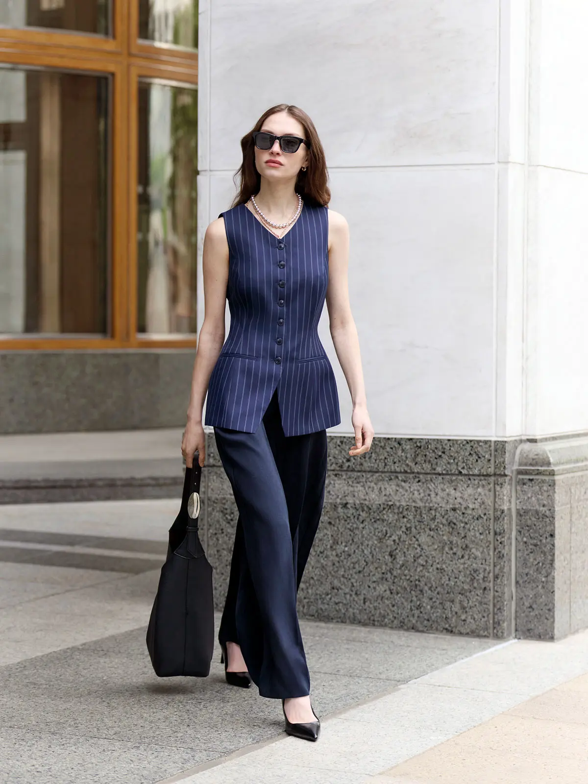 Woman wearing all-navy outfit 