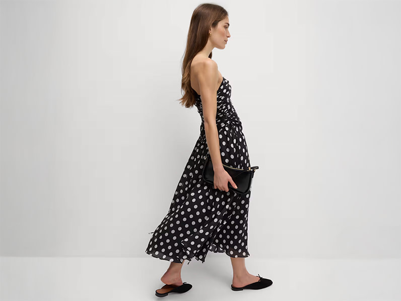 woman wearing black and white polka-dot dress