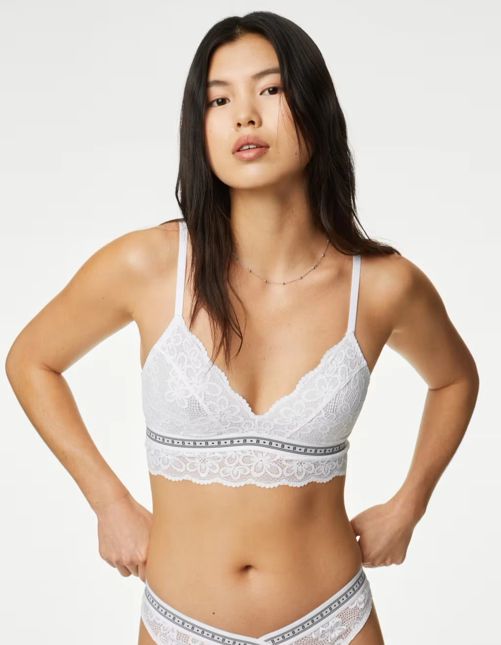 Woman wearing lace bralette for smaller busts