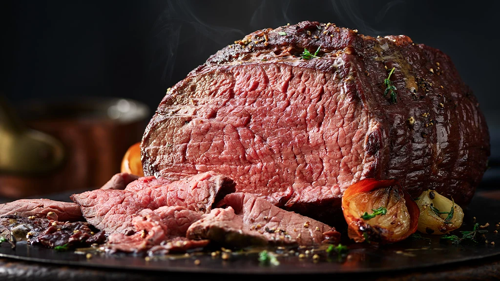 Roast beef on black plate