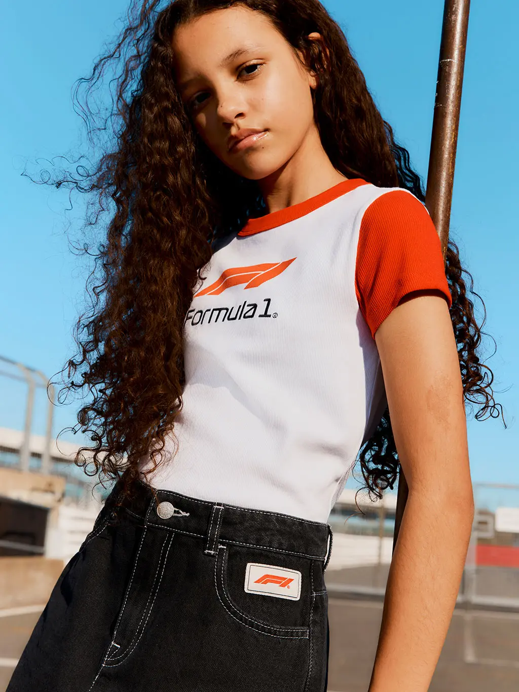 Girl in Formula 1 T-shirt and skirt