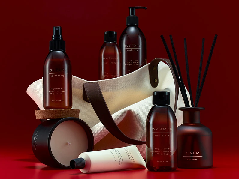 Group of M&S Apothecary wellness products, including candles, diffusers and creams. 