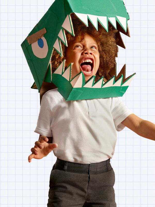Boy with dinosaur costume