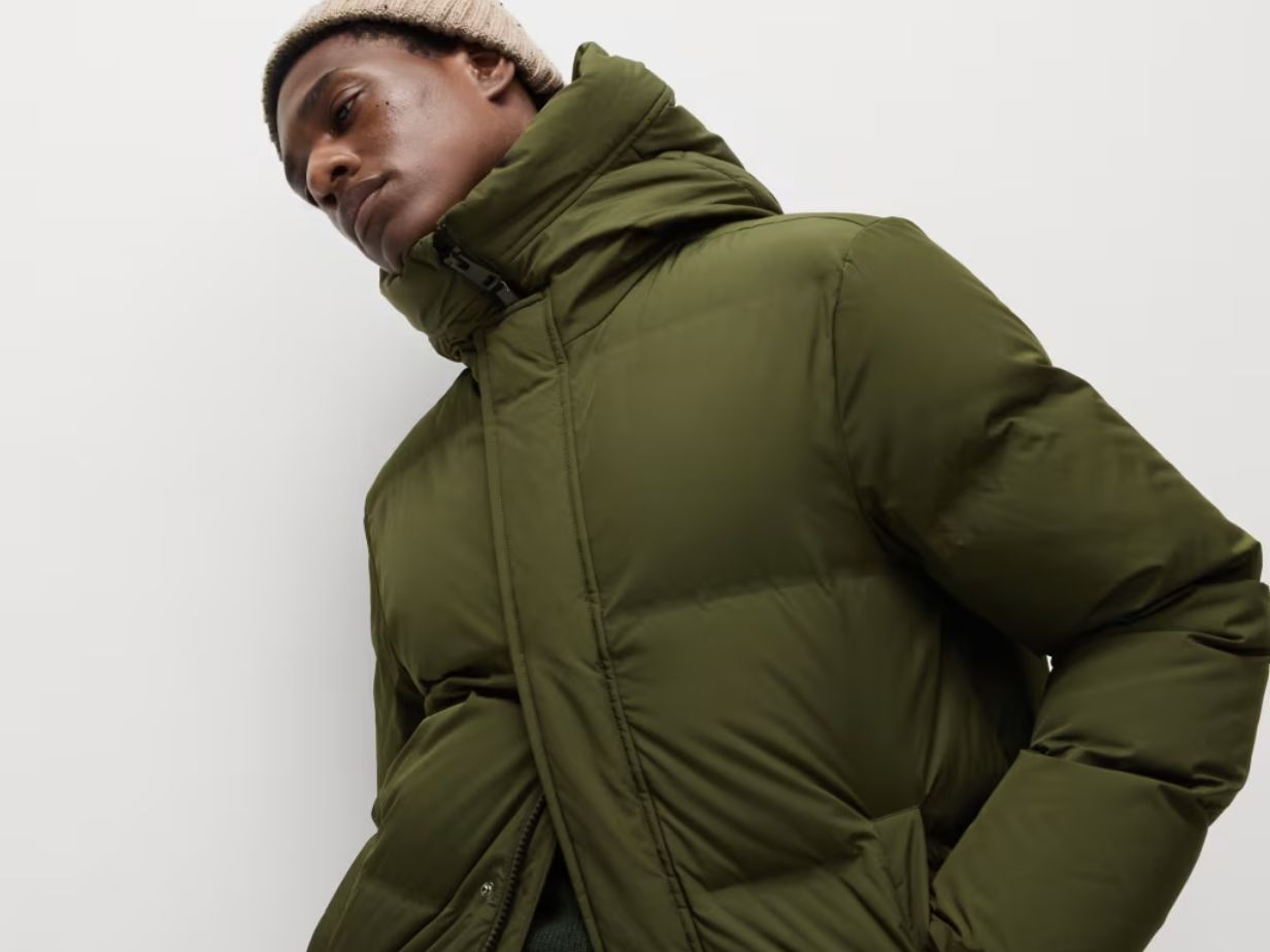 Man wearing green puffer jacket at M&S