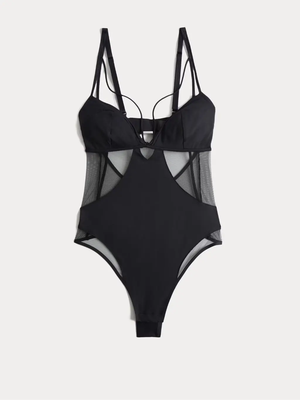 A cutout of a sheer panelled shaping body