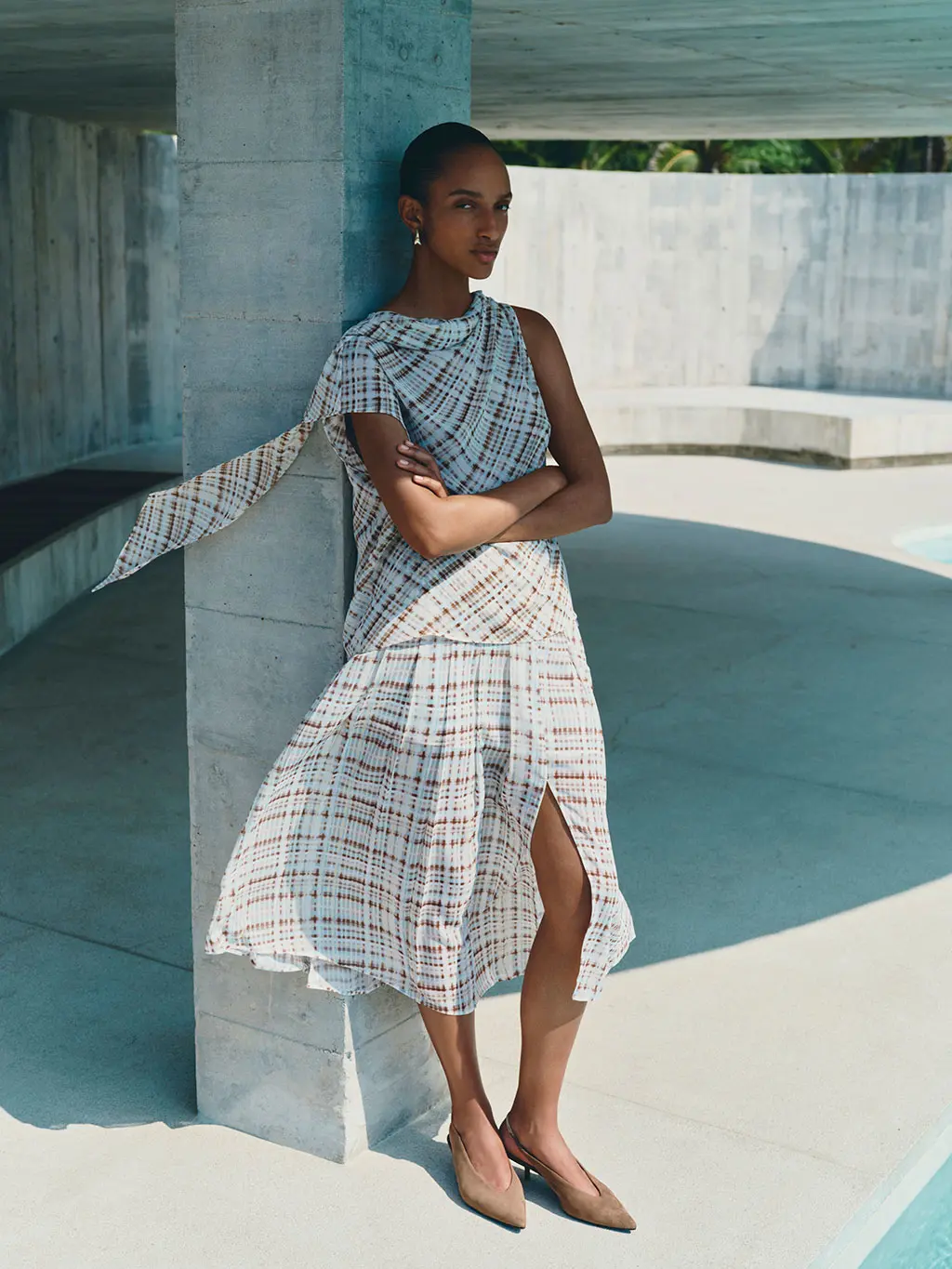 Woman wearing checked midi dress