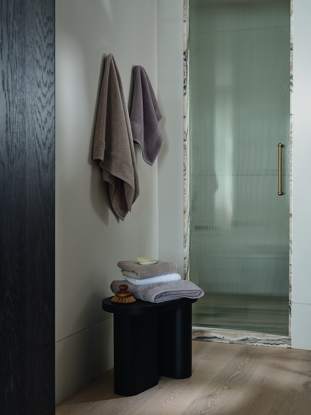 Mushroom brown towels from hanging in a bathroom