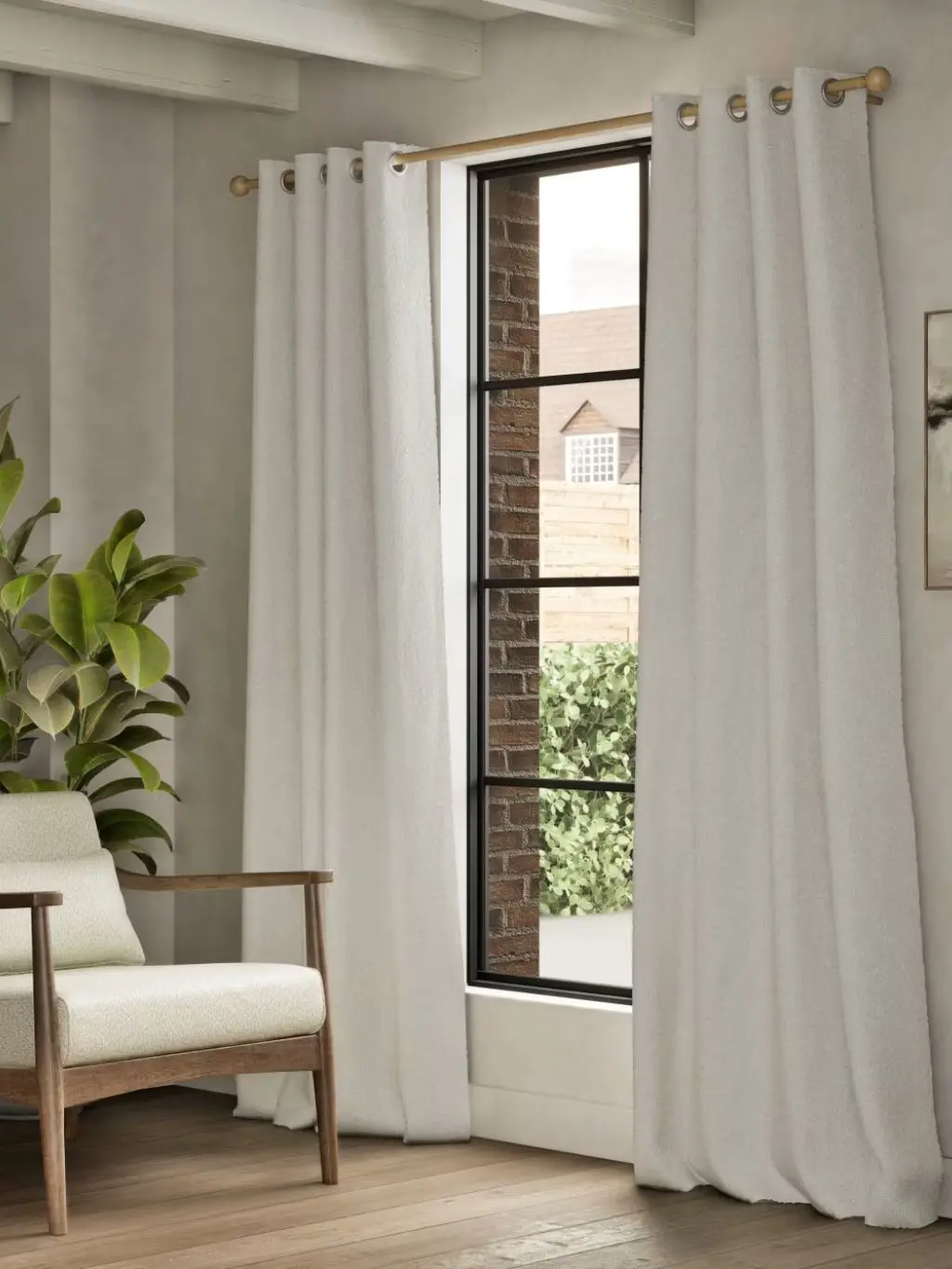 A room with white curtains and a white chair