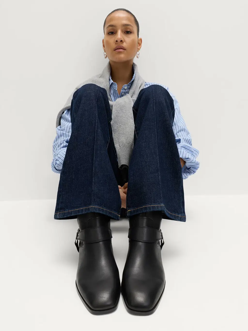 Woman in black boots and jeans