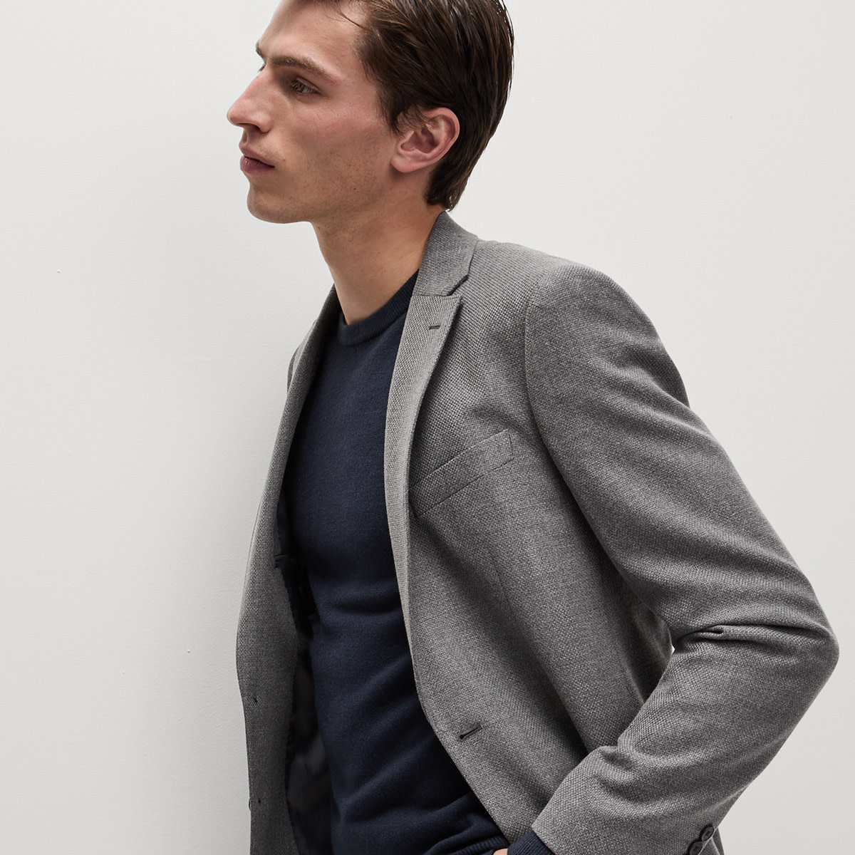 Man wearing grey coat