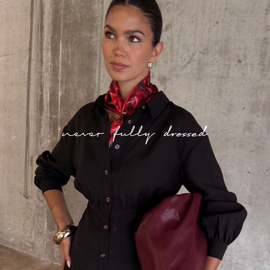 Woman wearing red neckerchief and brown cardigan by Never Fully Dressed