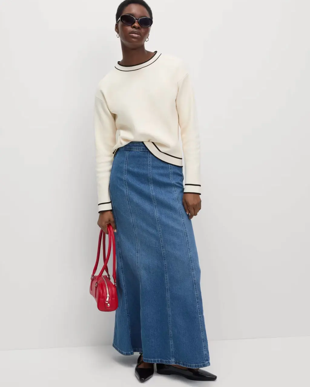 Woman wearing a blue denim maxi skirt