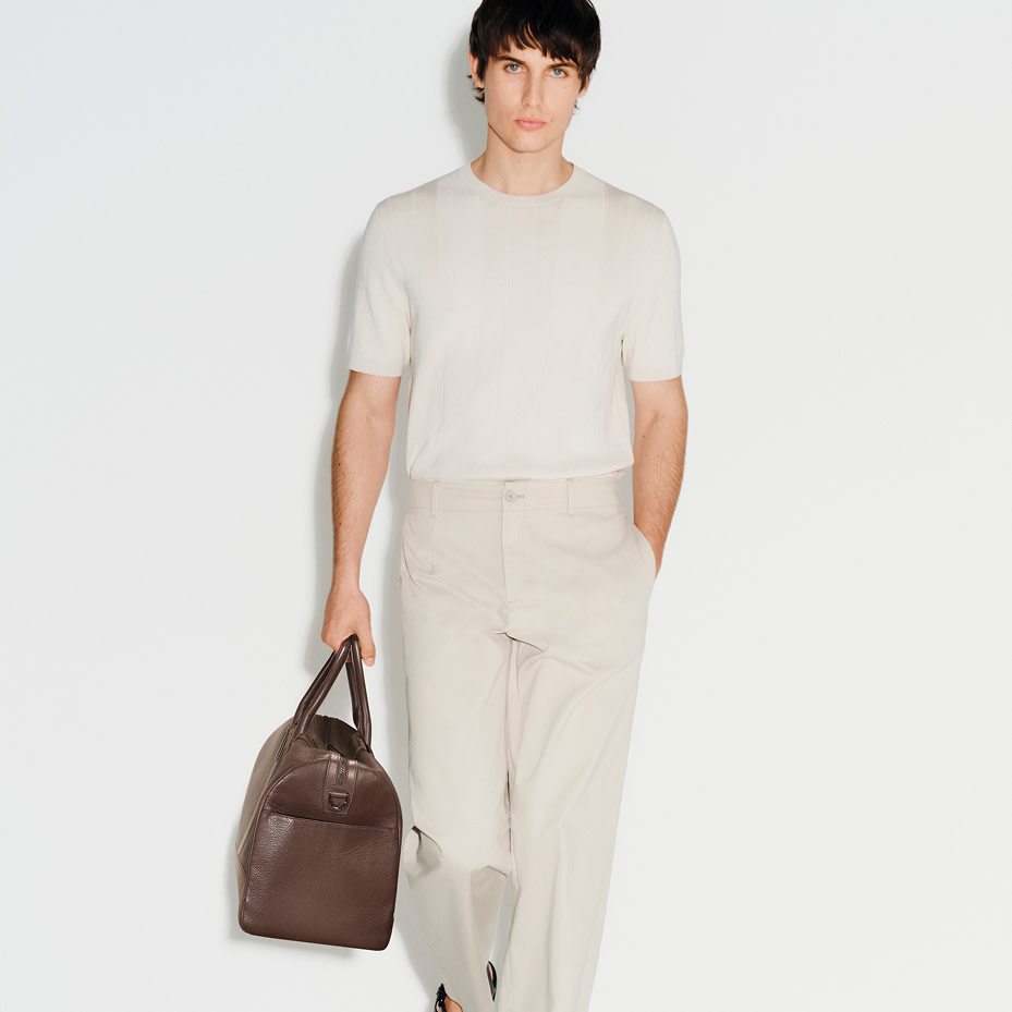 Man wearing white shirt and chinos