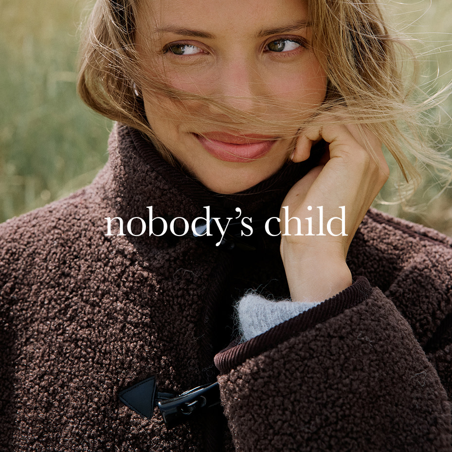 Woman wearing brown fleece jacket by Nobody's Child