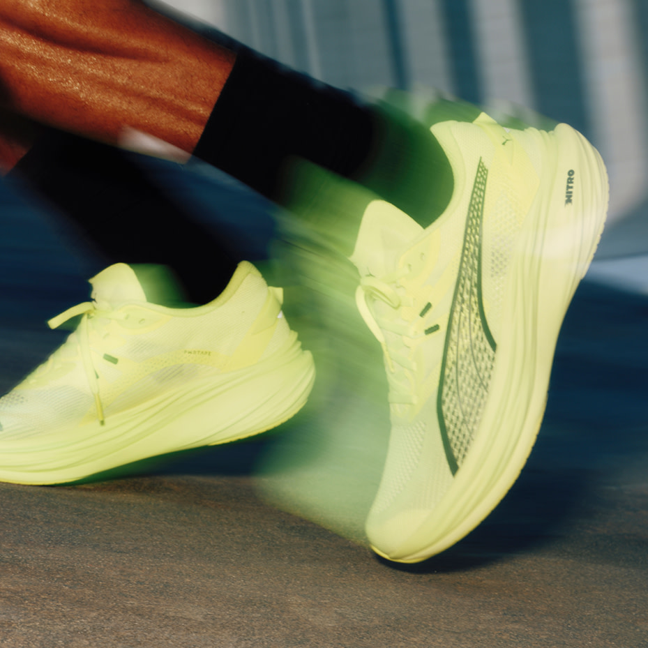 Man wearing lime-green trainers