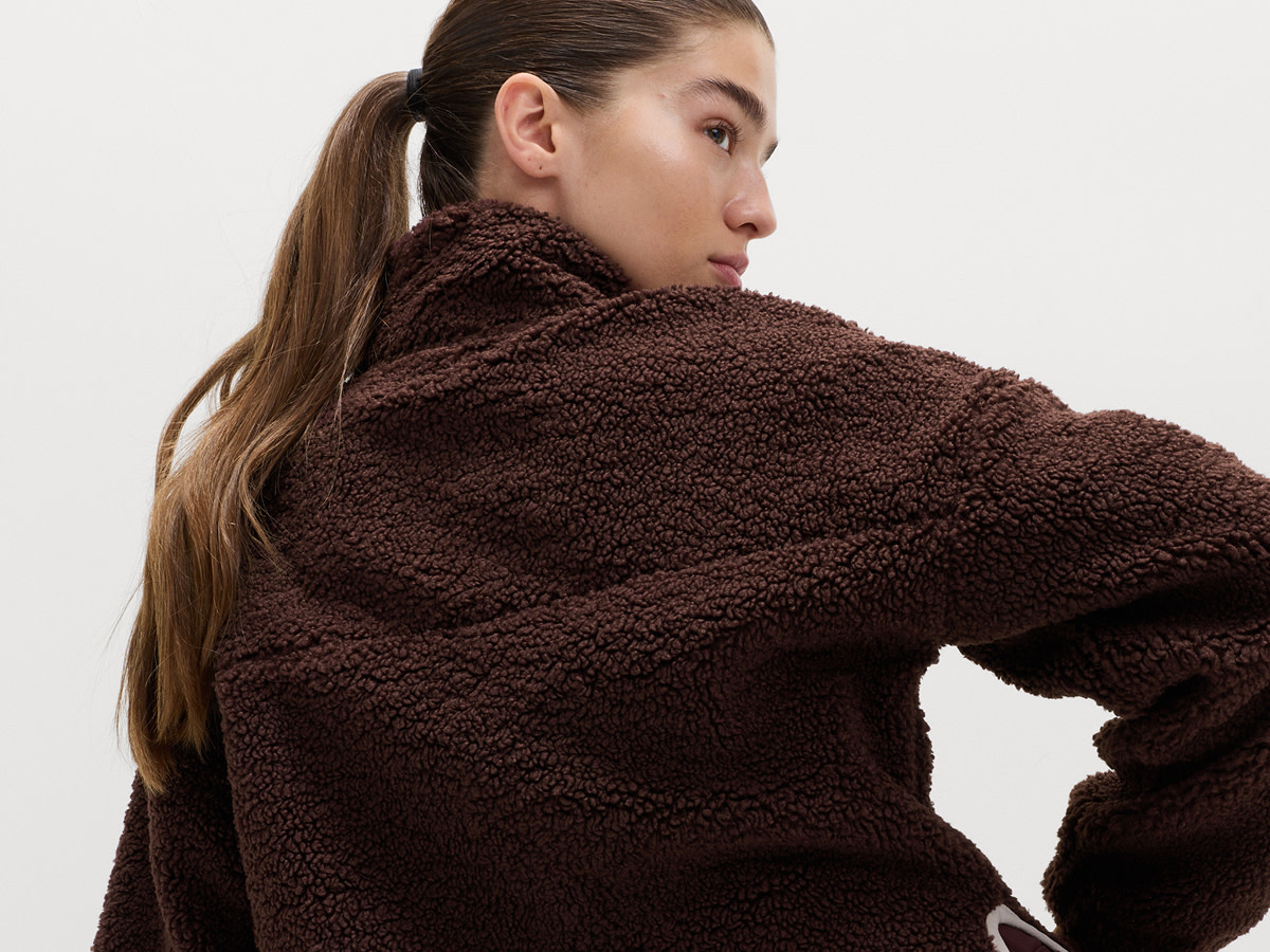 Woman wearing brown fleece