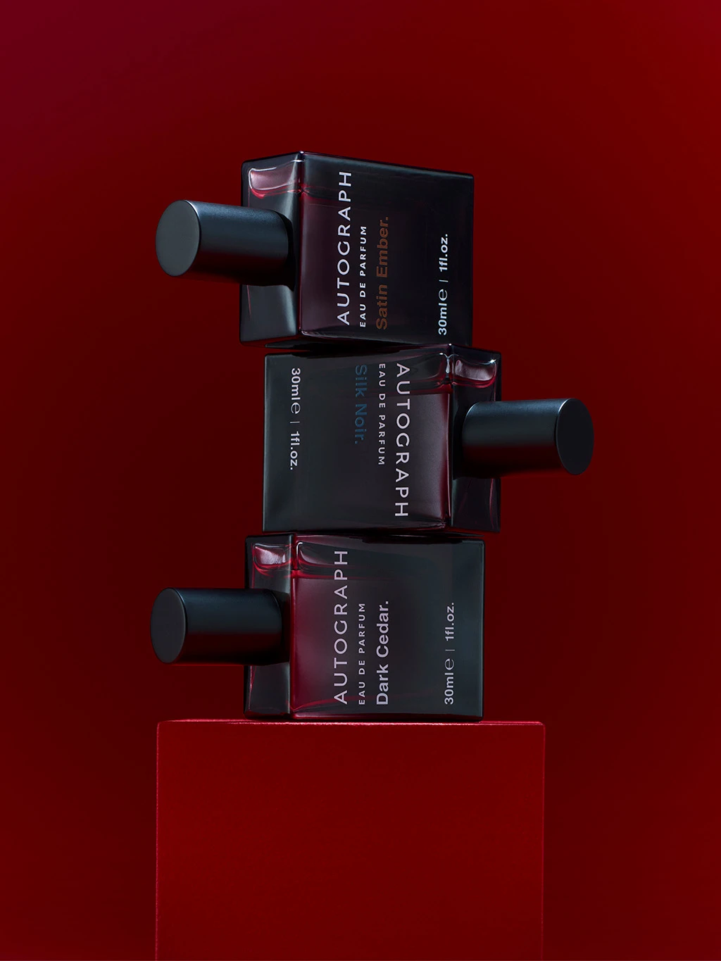 Stack of men's M&S Autograph perfumes in grey glass bottles.