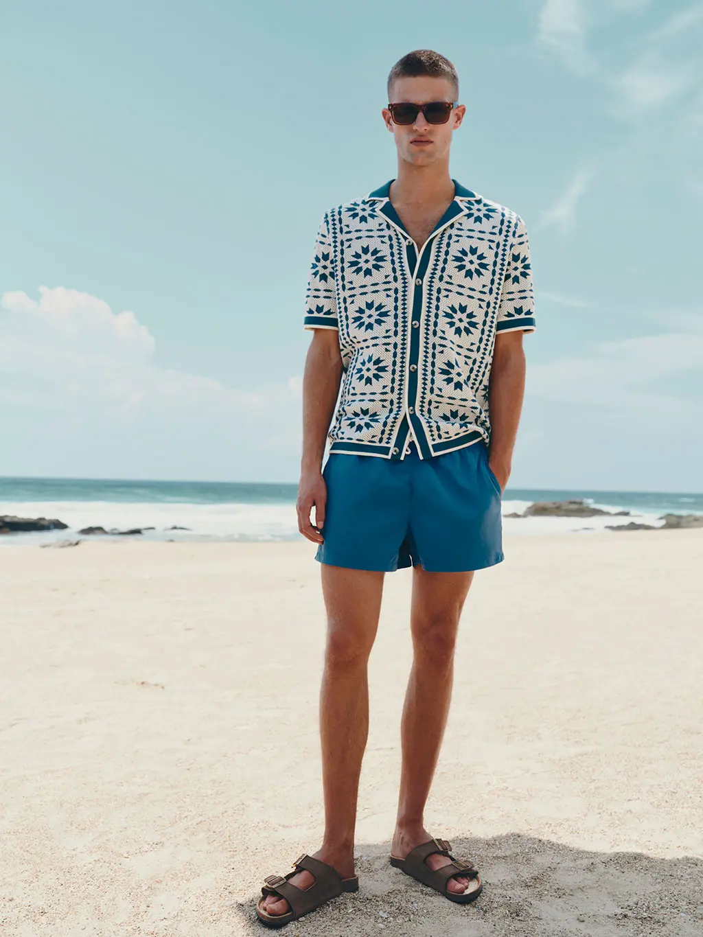 Man in shirt and blue shorts