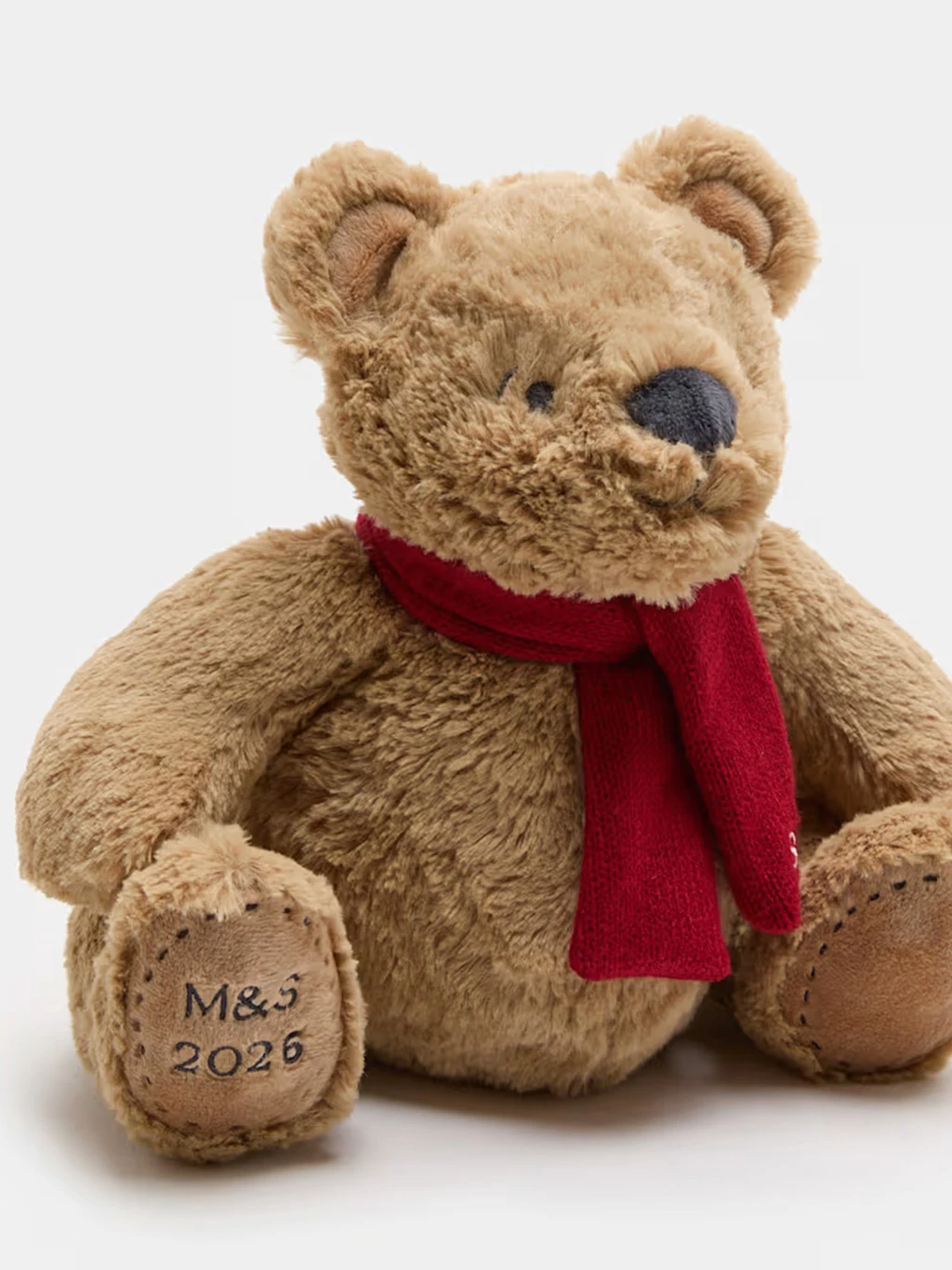 Spencer bear soft toy with a red scarf and M&S embroidered on the paw.