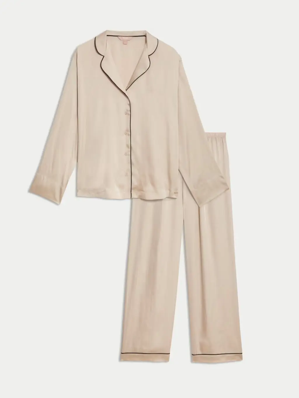 A cut out of cream satin pyjamas