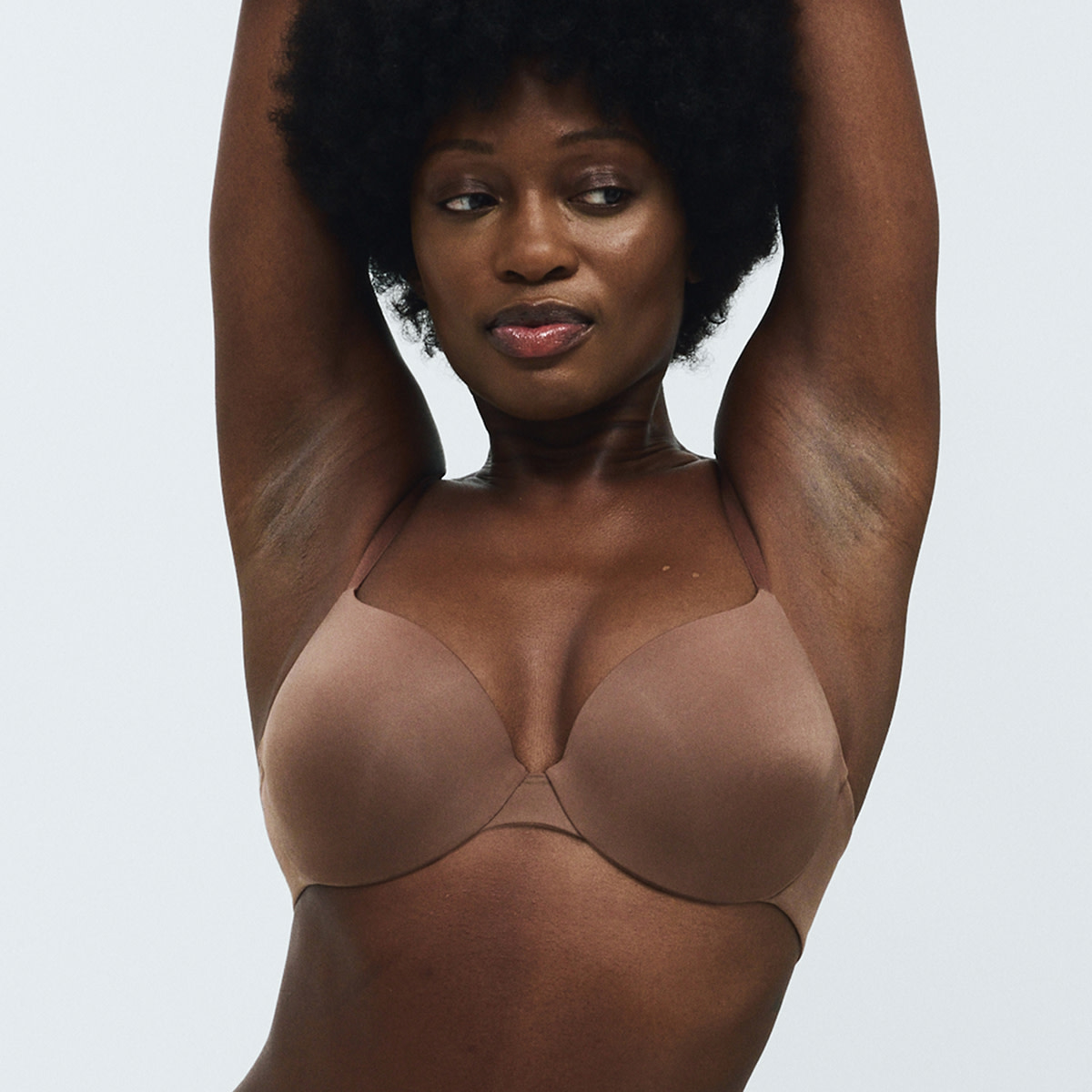Woman wearing brown bra 