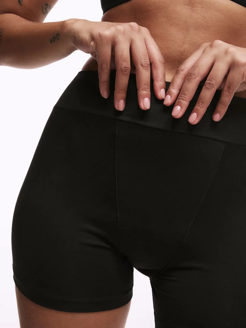 Woman wearing high absorbency period briefs