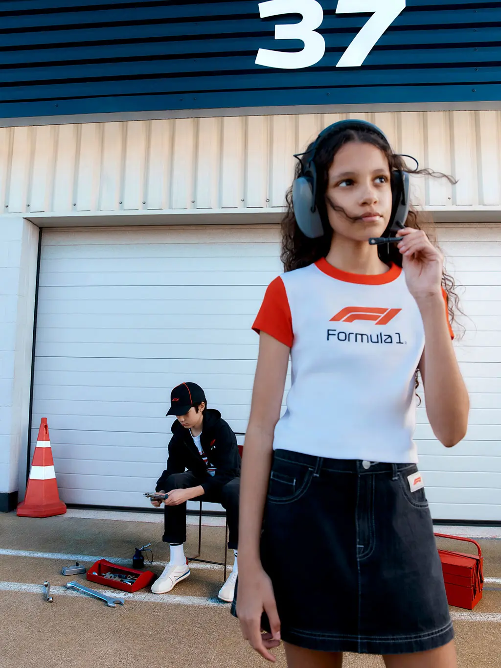 Girl with radio head set on race track