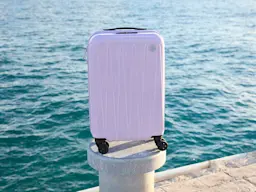 Lilac hard-shell carry-on suitcase