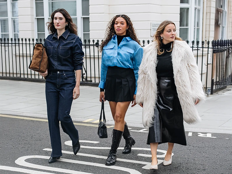 The Who What Wear editors crossing the street wearing outfits from the new Autograph collection