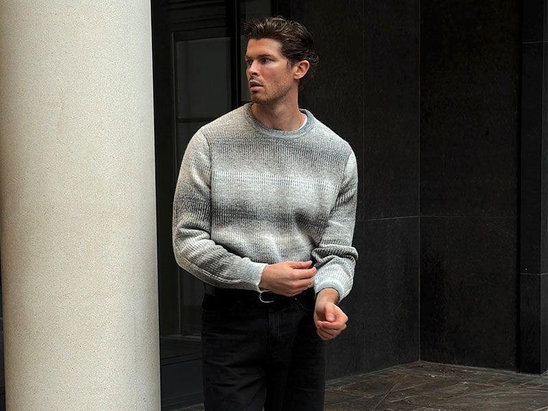 man wearing grey jumper