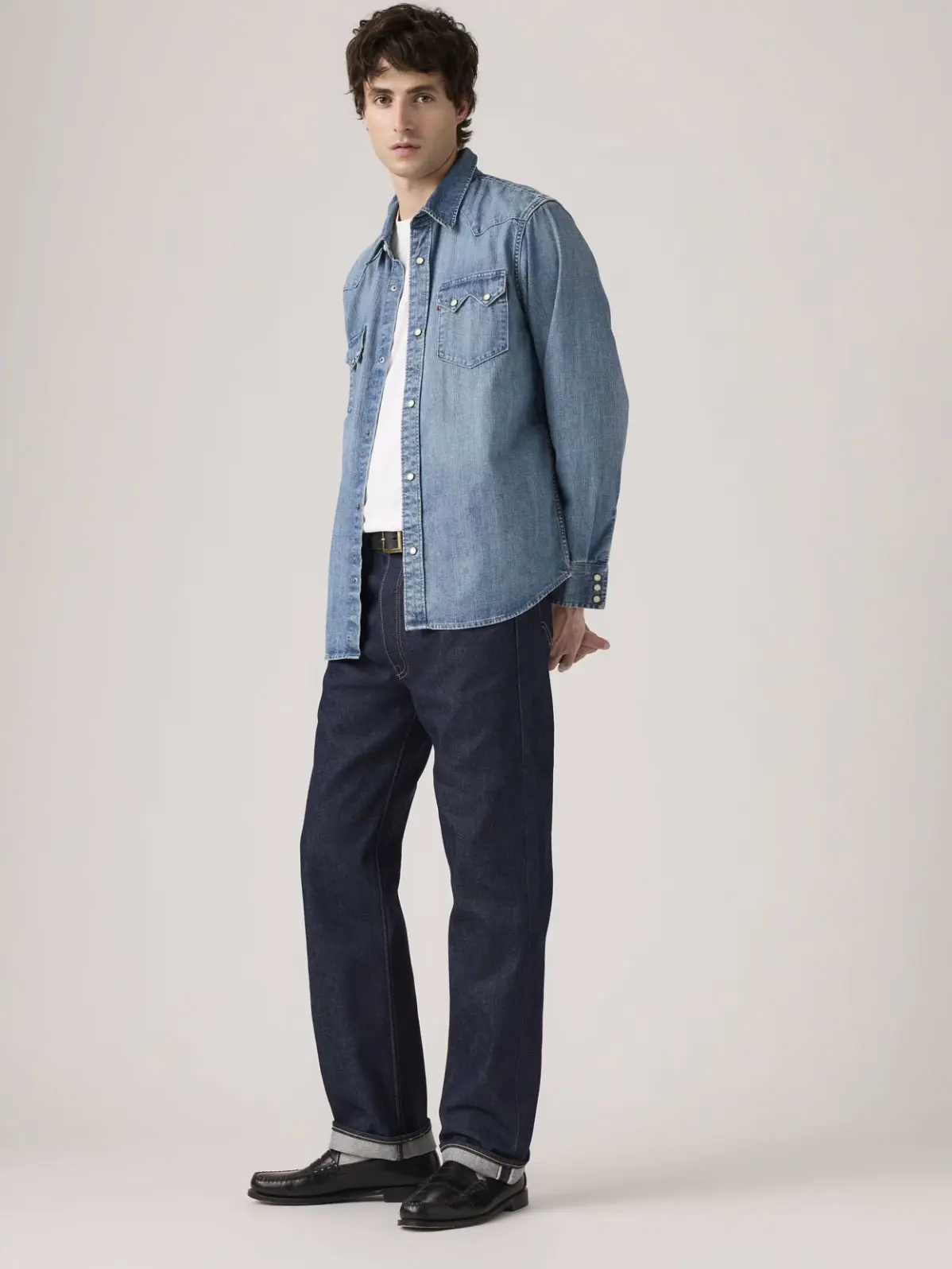 Man wearing denim shirt with jeans and loafers