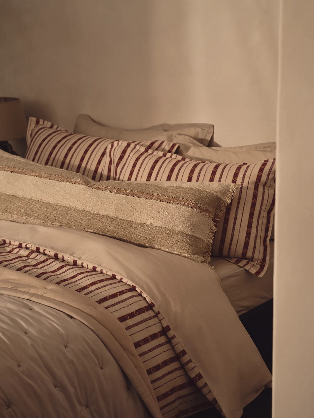 Bed made up with M&S X Fired Earth bedding 