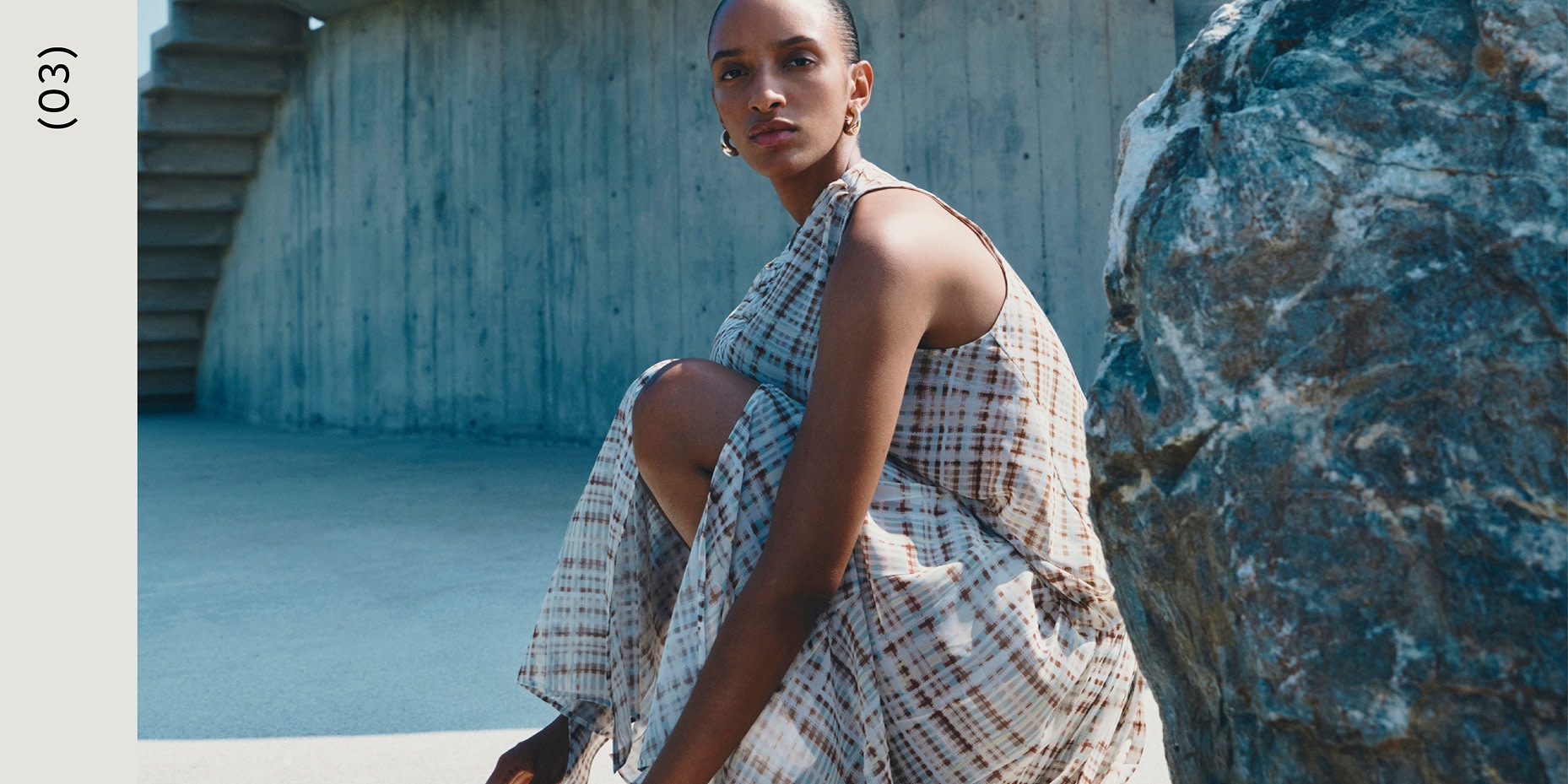 Woman in plaid dress