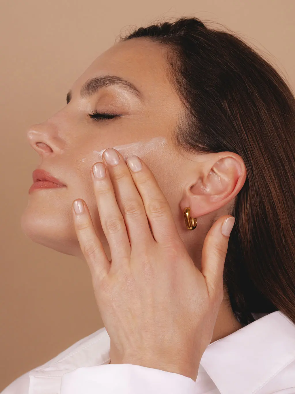 Woman applying skincare