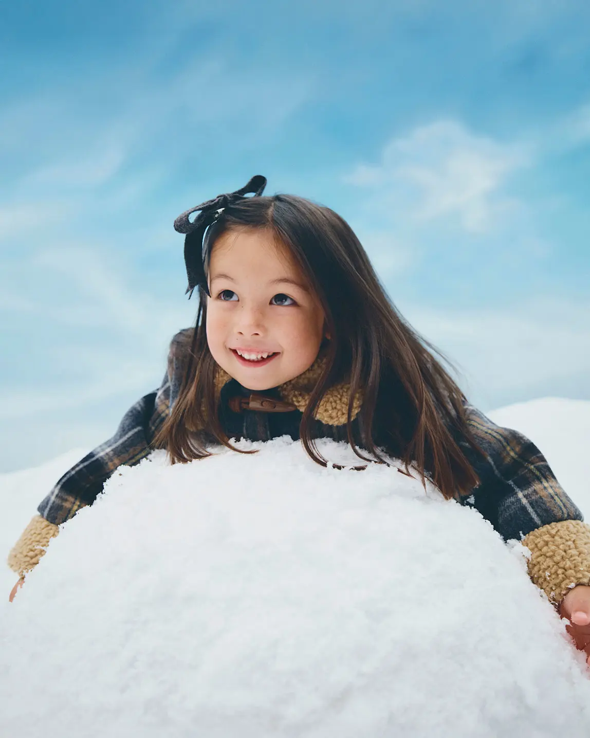 Girl wearing checcked jacket