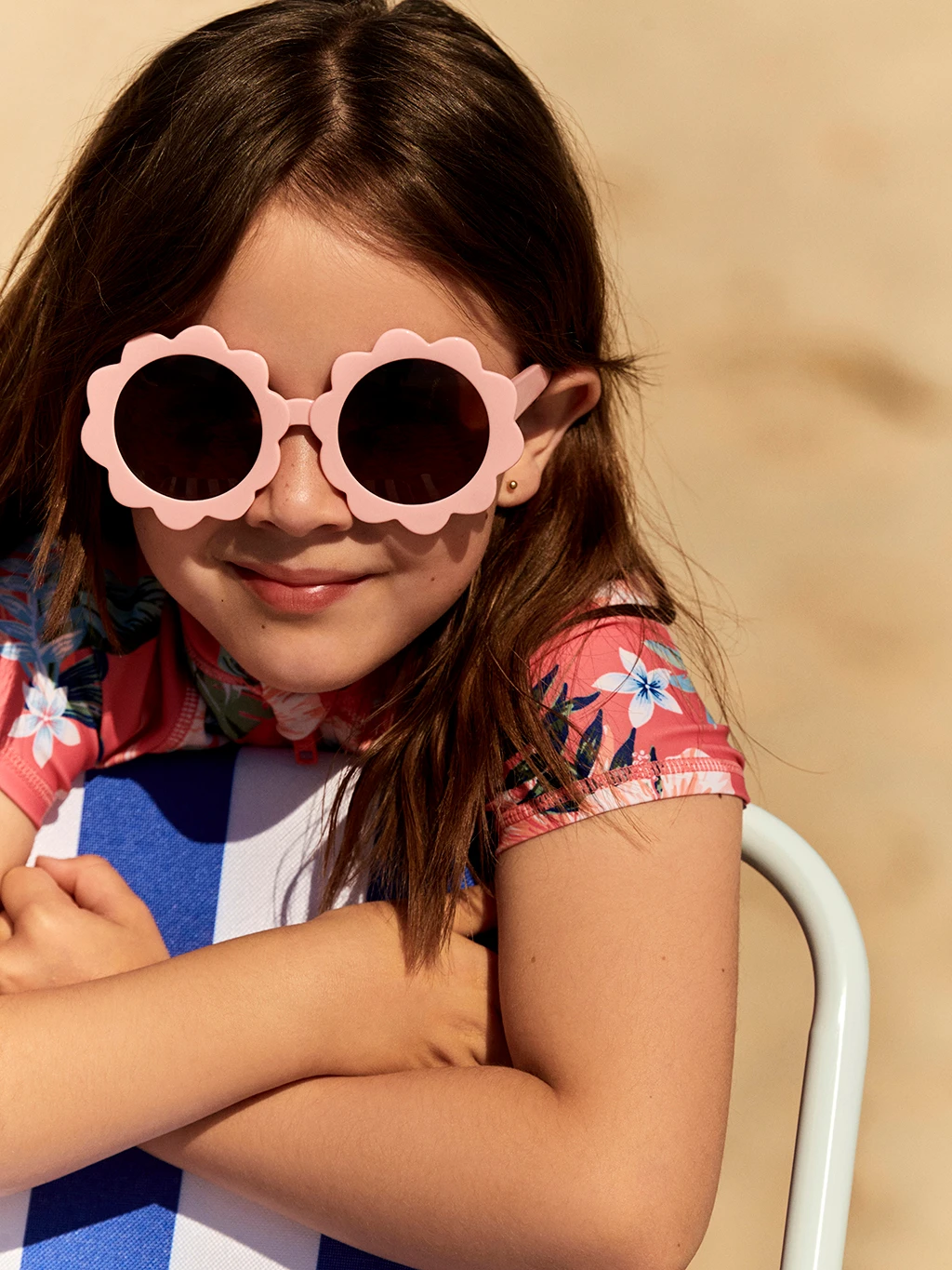 Girl wearing flower-shaped sunglasses