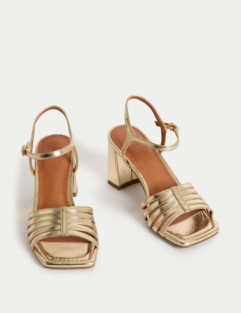 A pair of gold strappy heels