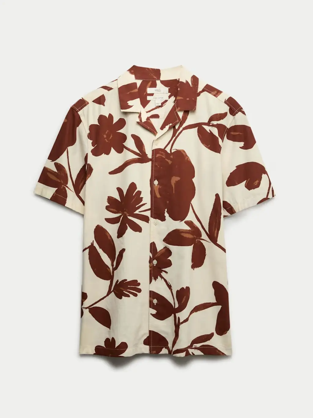 A cutout of a brown and cream floral shirt by M&S